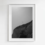 Framed black and white artwork of a mountain and two seagulls flying together in Santa Barbara, California.