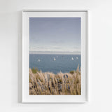 Framed artwork of a coastal scene with sailboats on the water of Santa Barbara, CA.