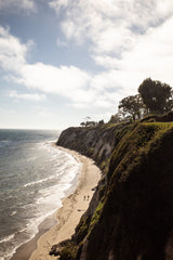 Standing Still two people walking on California coast beach sand