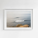 Framed photograph of a lone surfer catching the waves in Sunset Cliffs, San Diego.