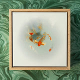 Framed artwork of goldfish on a green marbled background
