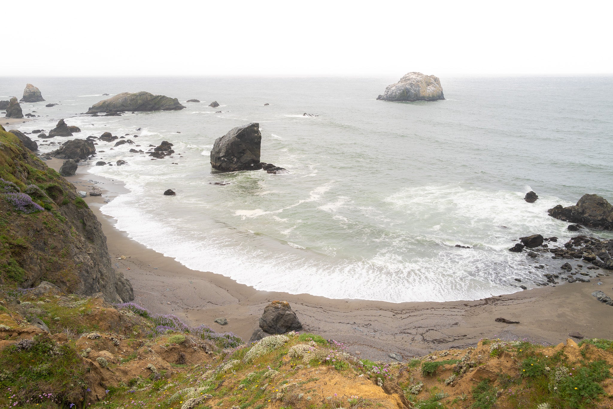 Tidal rugged cliffs embracing restless Pacific on Sonoma Coast